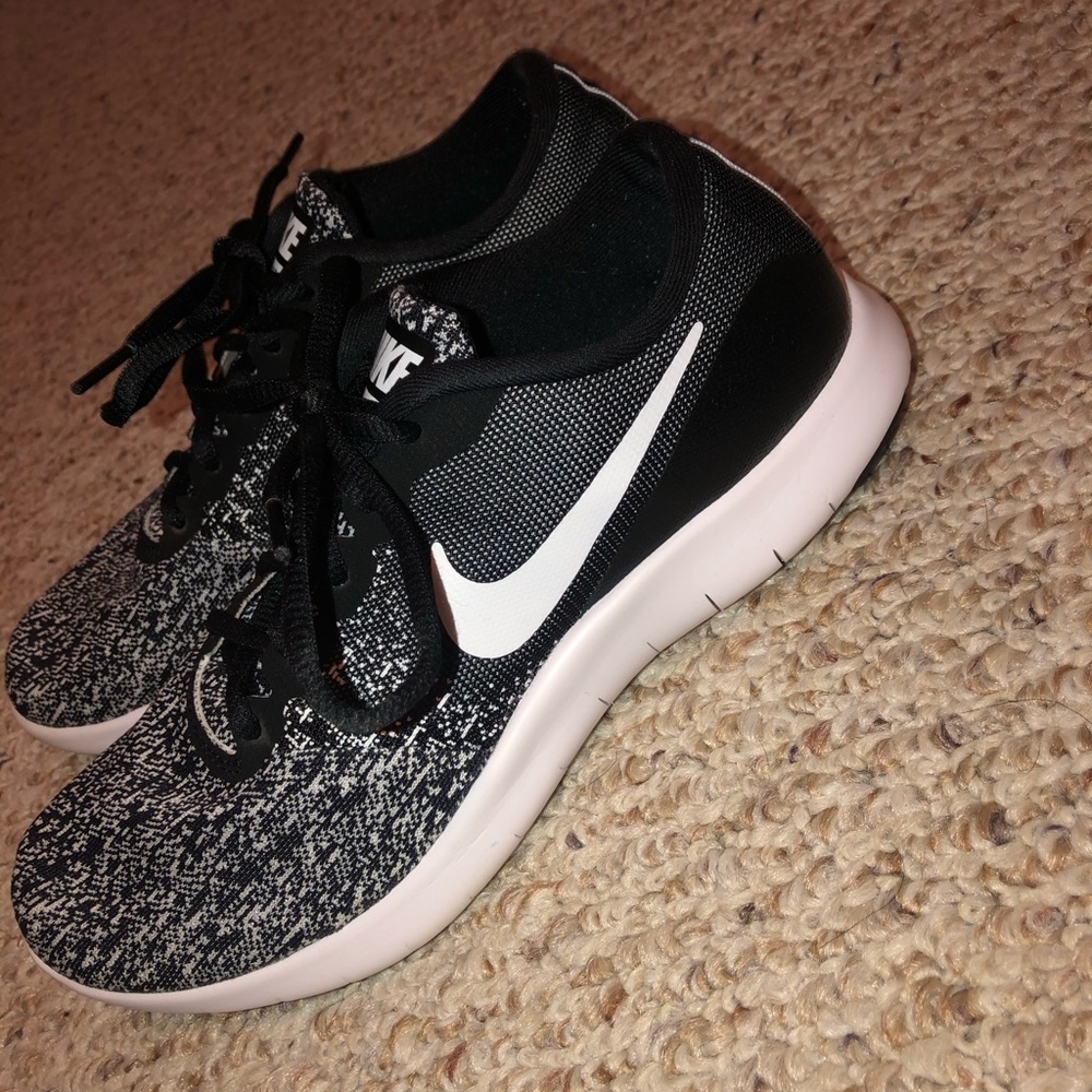 Black and white peppered Nike running shoes